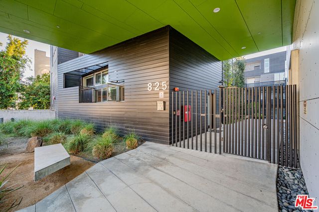 a view of a pathway both side of house