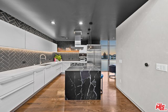 a kitchen with a sink and cabinets