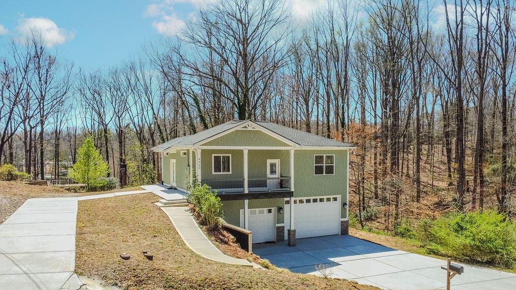4660 Perry Road Gainesville, GA 30506 - Photo 1 of 1 a front view of a house with a garden