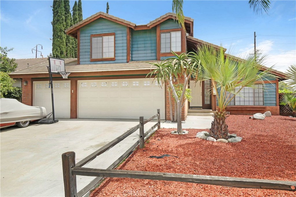 14190 Rio Bravo Road Moreno Valley, CA 92553 - Photo 1 of 1 a front view of a house with garden