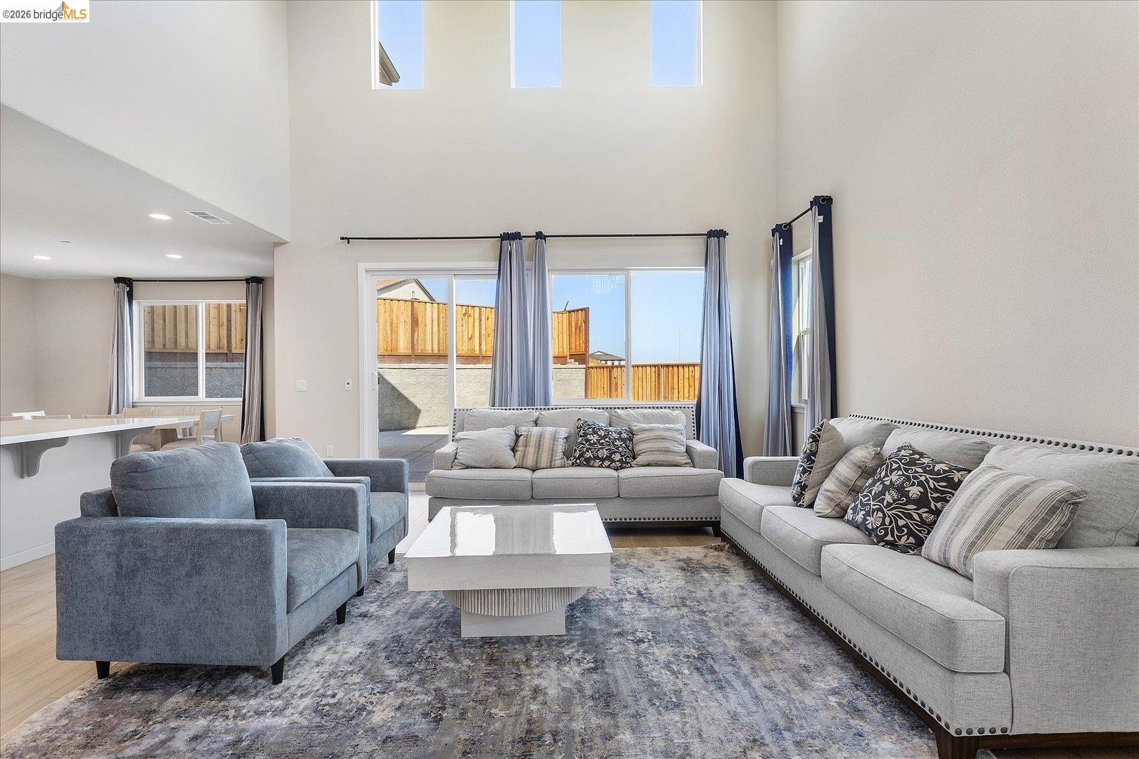 5601 Ridgepoint Way Antioch, CA 94531 - Photo 8 of 59 Spacious living area featuring a vaulted ceiling and three high transom windows