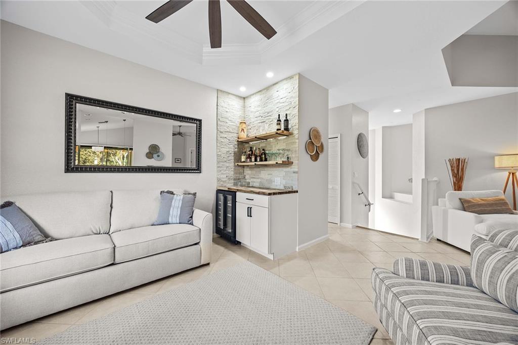 6864 Ascot Drive, Unit 5202 Naples, FL 34113 - Photo 15 of 36 a living room with furniture and a couch