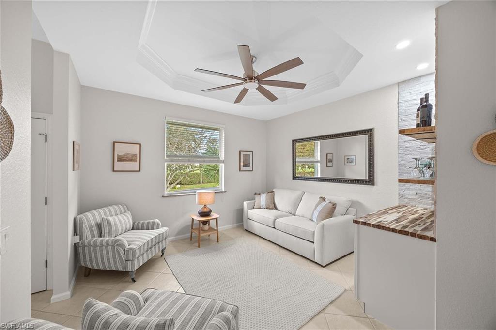 6864 Ascot Drive, Unit 5202 Naples, FL 34113 - Photo 16 of 36 a living room with furniture and a couch