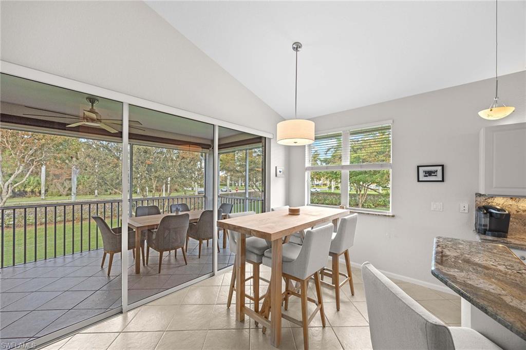 6864 Ascot Drive, Unit 5202 Naples, FL 34113 - Photo 17 of 36 a view of a dining room with furniture window and outside view