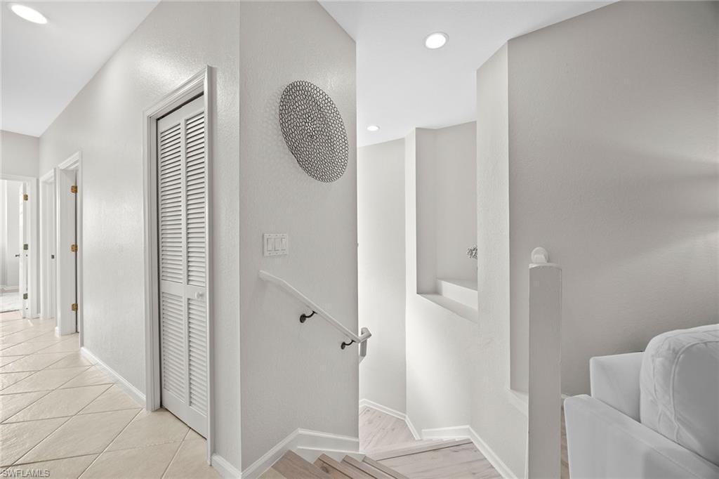 6864 Ascot Drive, Unit 5202 Naples, FL 34113 - Photo 6 of 36 wooden floor in a gallery