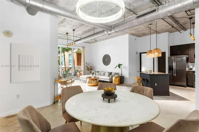 a very nice looking dining room with a table and chairs