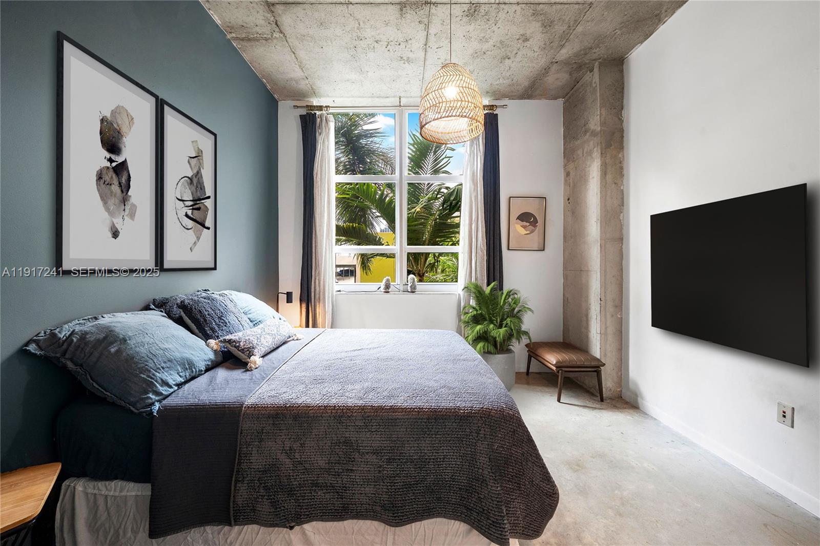 2001 Biscayne Boulevard, Unit 2409 Miami, FL 33137 - Photo 17 of 48 a bedroom with a bed and a flat screen tv