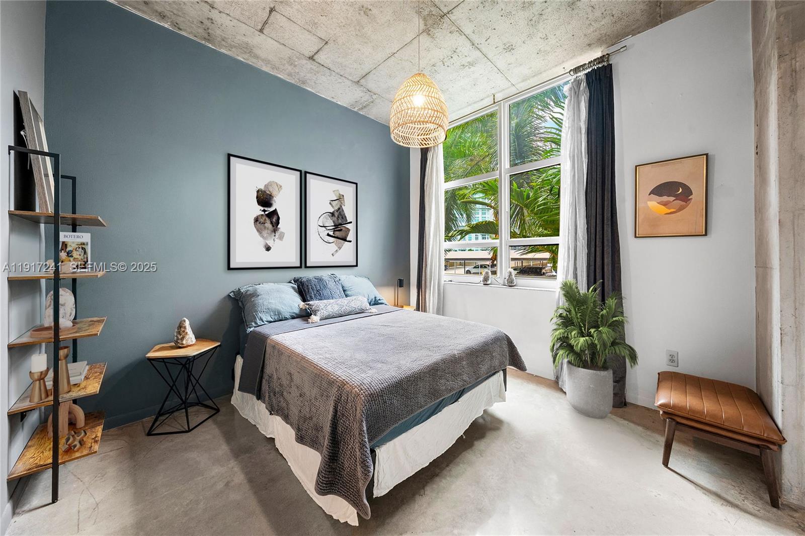 2001 Biscayne Boulevard, Unit 2409 Miami, FL 33137 - Photo 18 of 48 a bedroom with a bed and a chair