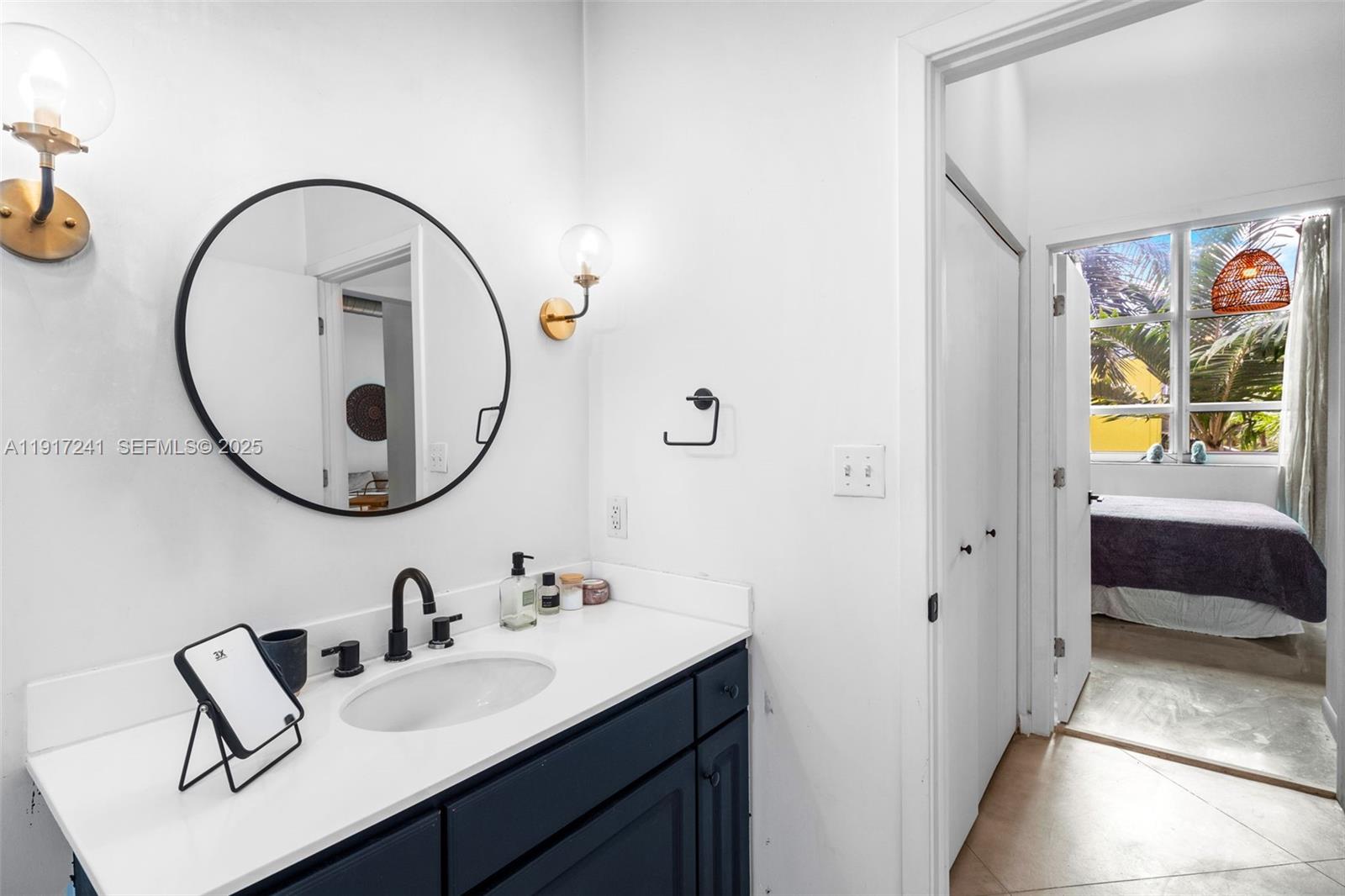 2001 Biscayne Boulevard, Unit 2409 Miami, FL 33137 - Photo 20 of 48 a bathroom with a sink and a mirror