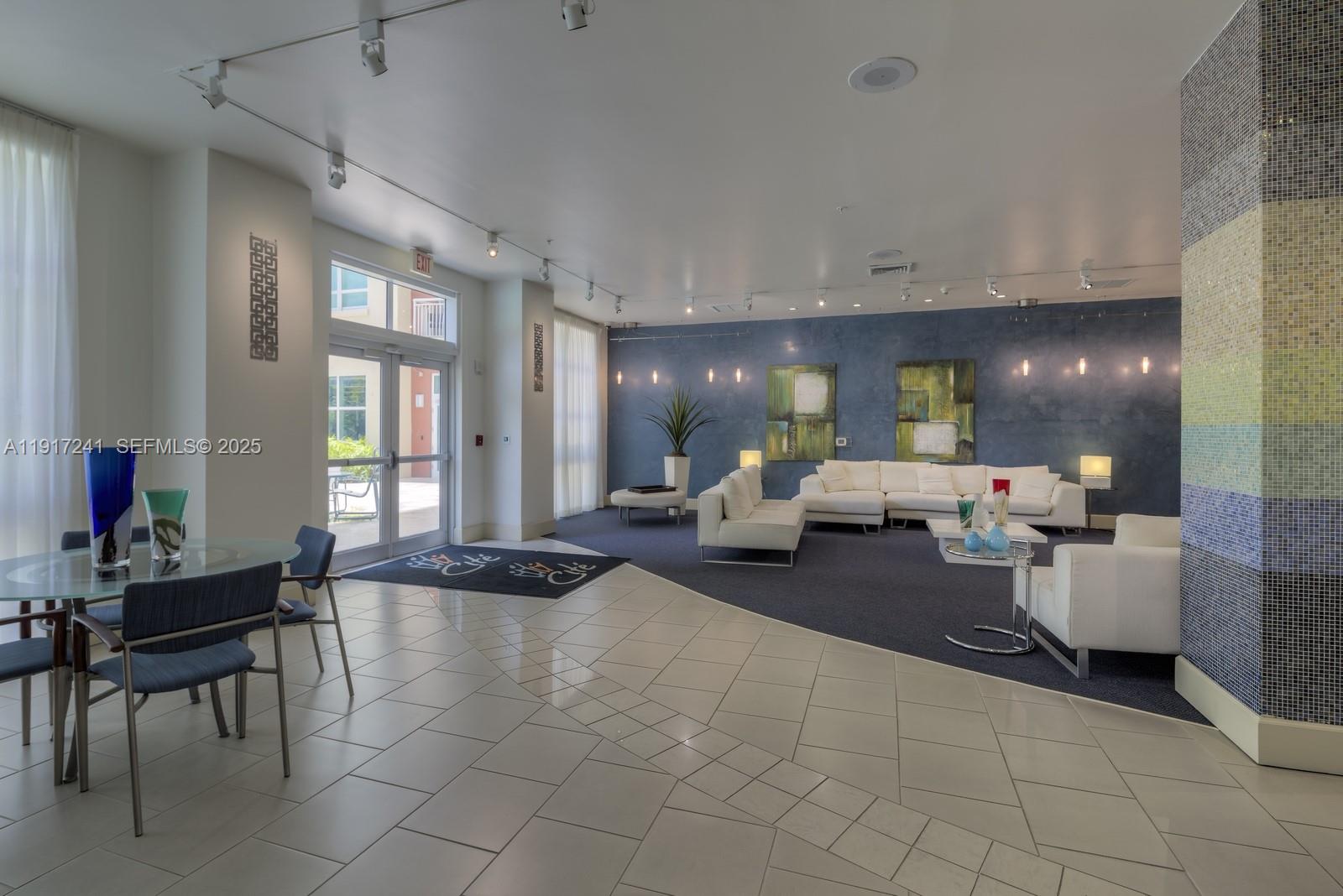 2001 Biscayne Boulevard, Unit 2409 Miami, FL 33137 - Photo 29 of 48 a living room with furniture and large windows