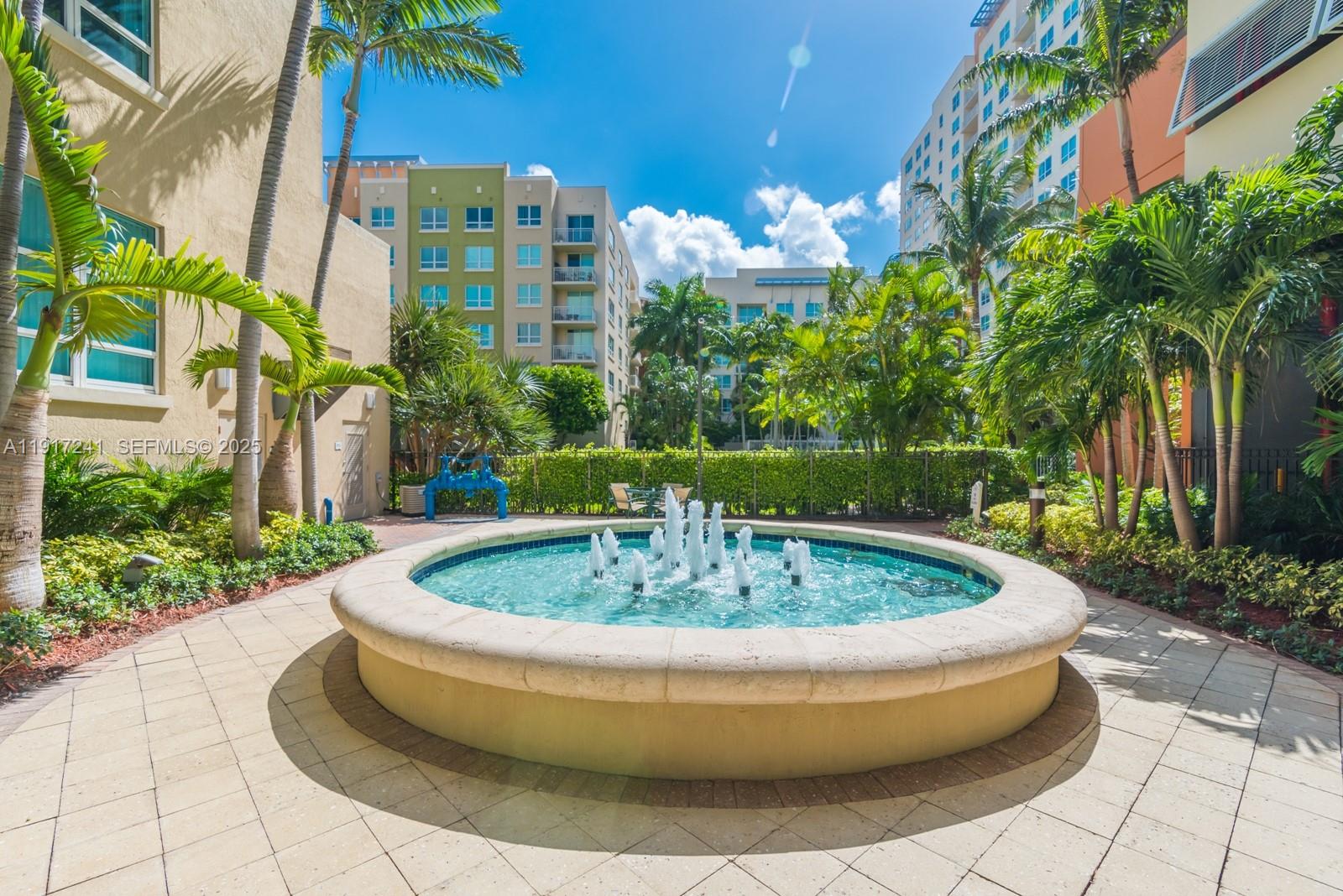 2001 Biscayne Boulevard, Unit 2409 Miami, FL 33137 - Photo 33 of 48 a view of a fountain with a house in the background