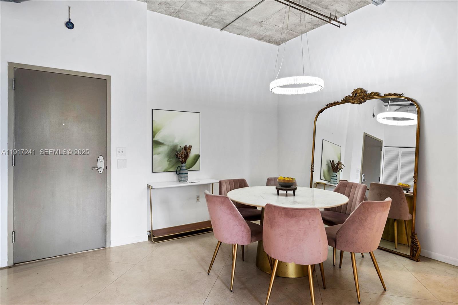 2001 Biscayne Boulevard, Unit 2409 Miami, FL 33137 - Photo 4 of 48 a dining room with furniture and window