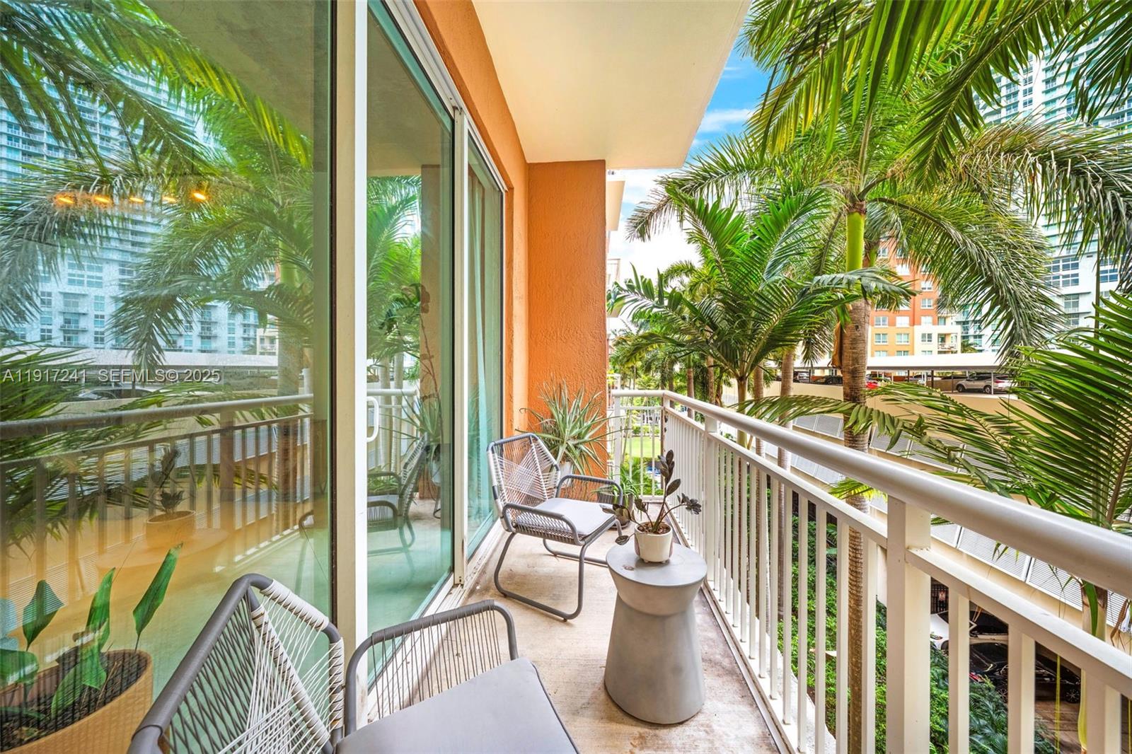 2001 Biscayne Boulevard, Unit 2409 Miami, FL 33137 - Photo 10 of 48 a view of a balcony with lake view and a potted plant