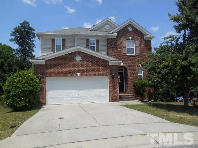 6131 Ricker Road Raleigh, NC 27610 - Photo 1 of 15 a front view of a house with a garden