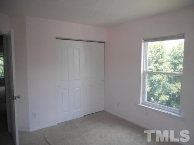 6131 Ricker Road Raleigh, NC 27610 - Photo 13 of 15 an empty room with a window