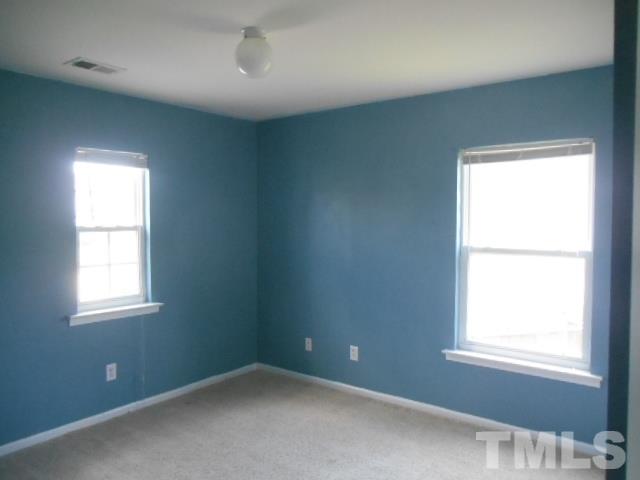 6131 Ricker Road Raleigh, NC 27610 - Photo 14 of 15 an empty room with a window