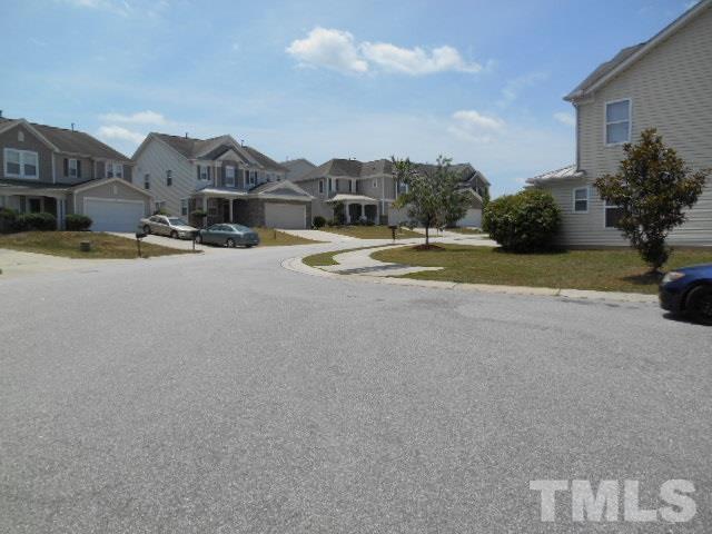 6131 Ricker Road Raleigh, NC 27610 - Photo 4 of 15 a view of multiple houses with a swimming pool