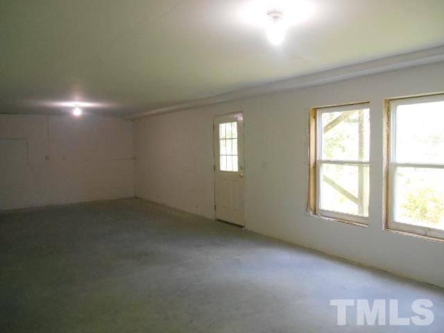6131 Ricker Road Raleigh, NC 27610 - Photo 7 of 15 an empty room with a window