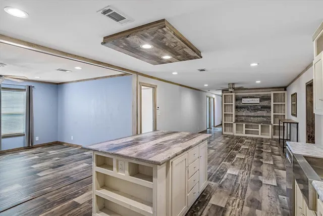 a kitchen with stainless steel appliances granite countertop a stove and a refrigerator