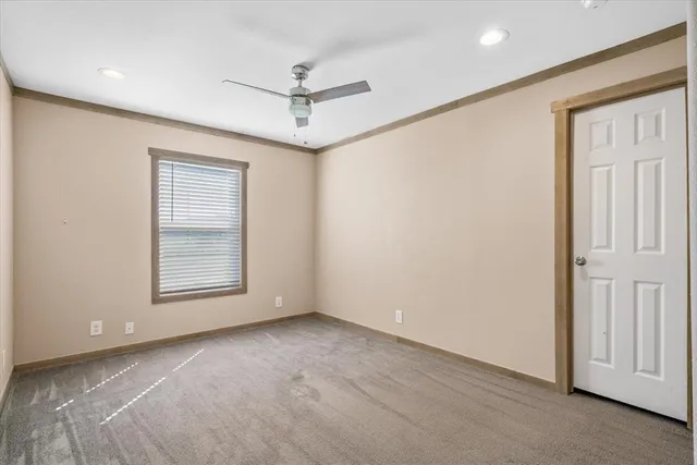 a bedroom with a bed and a chair