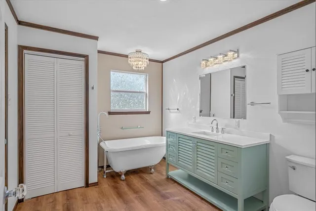 a spacious bedroom with a large bed and a large window