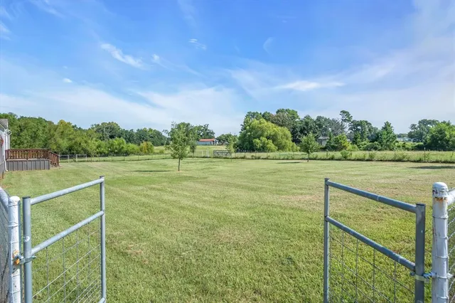 a view of outdoor space with deck and yard