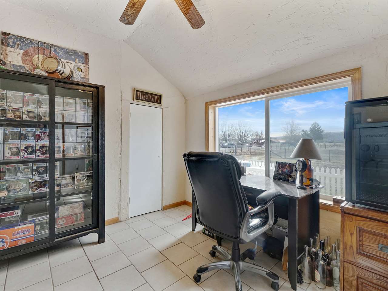 1195 19 Road Fruita, CO 81521 - Photo 13 of 31 a view of a workspace with furniture and a window