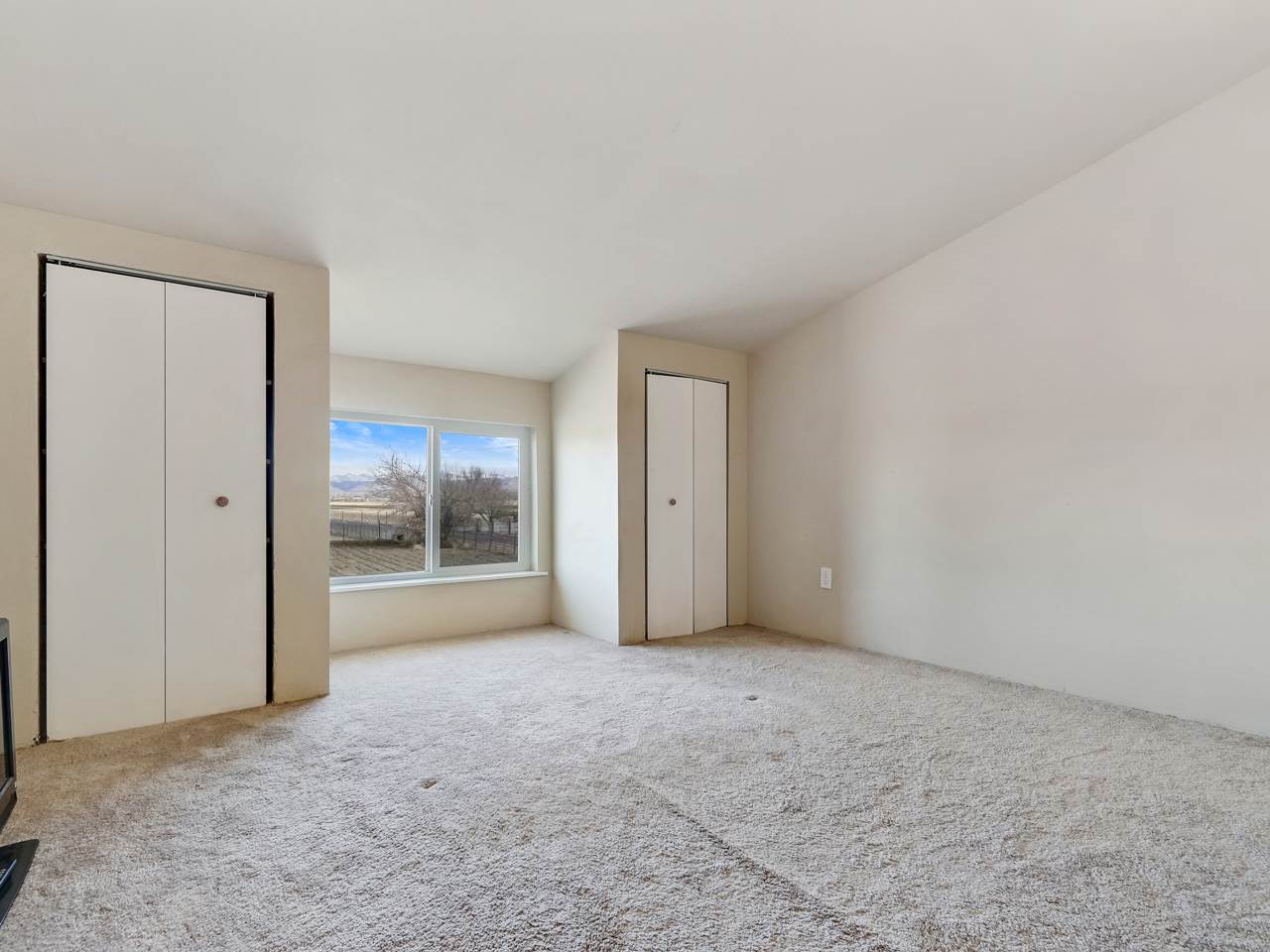 1195 19 Road Fruita, CO 81521 - Photo 19 of 31 a view of an empty room and a window