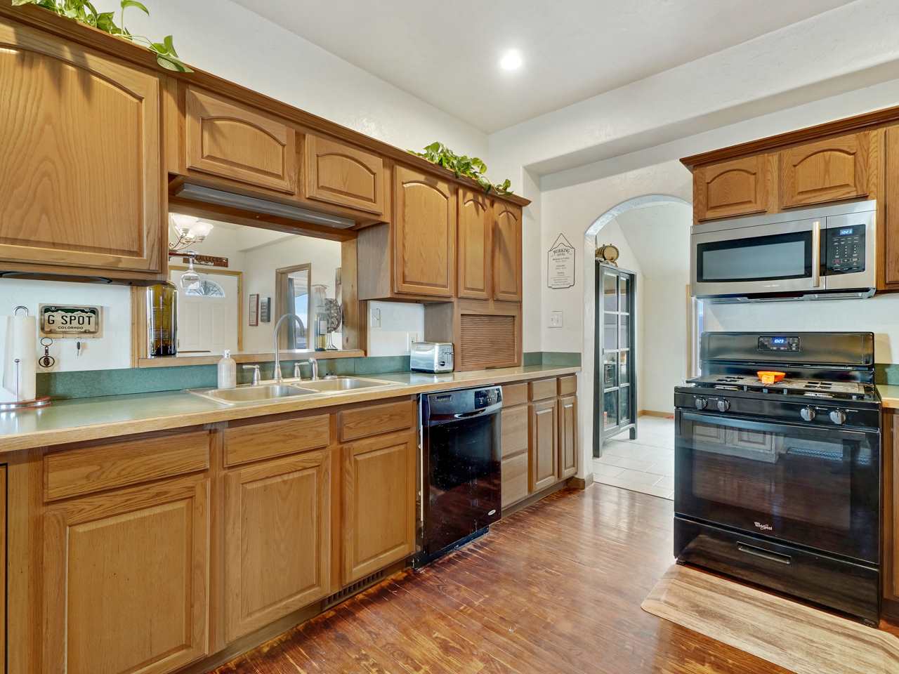 1195 19 Road Fruita, CO 81521 - Photo 5 of 31 a kitchen with stainless steel appliances granite countertop a stove and a sink