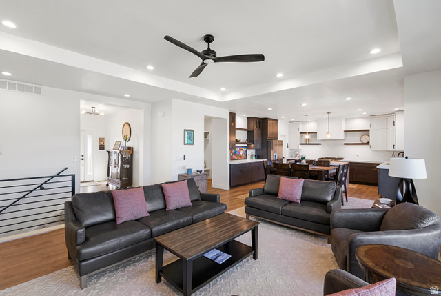 851 Grandview Drive Morgan, UT 84050 - Photo 17 of 68 Open-concept living area featuring light wood-finish flooring, a contemporary ceiling fan, recessed lighting, and a white interior paint scheme