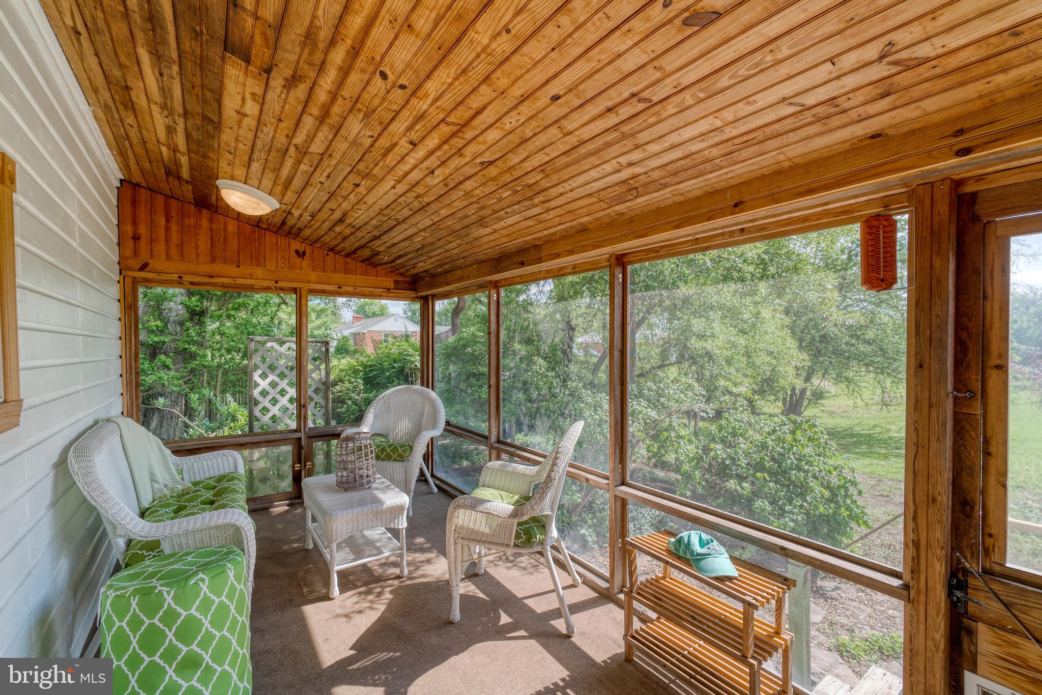 1728 Appleton Road Elkton, MD 21921 - Photo 17 of 36 a patio with table and chairs and couches with wooden roof and stairs