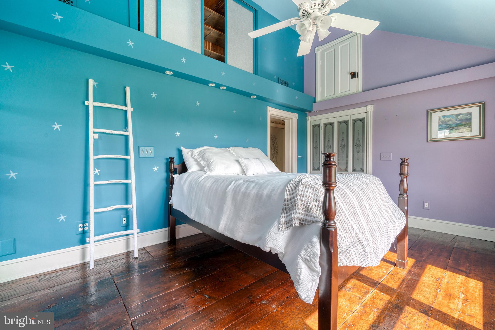 1728 Appleton Road Elkton, MD 21921 - Photo 27 of 36 a bed sitting in a bedroom next to a window and a chandelier