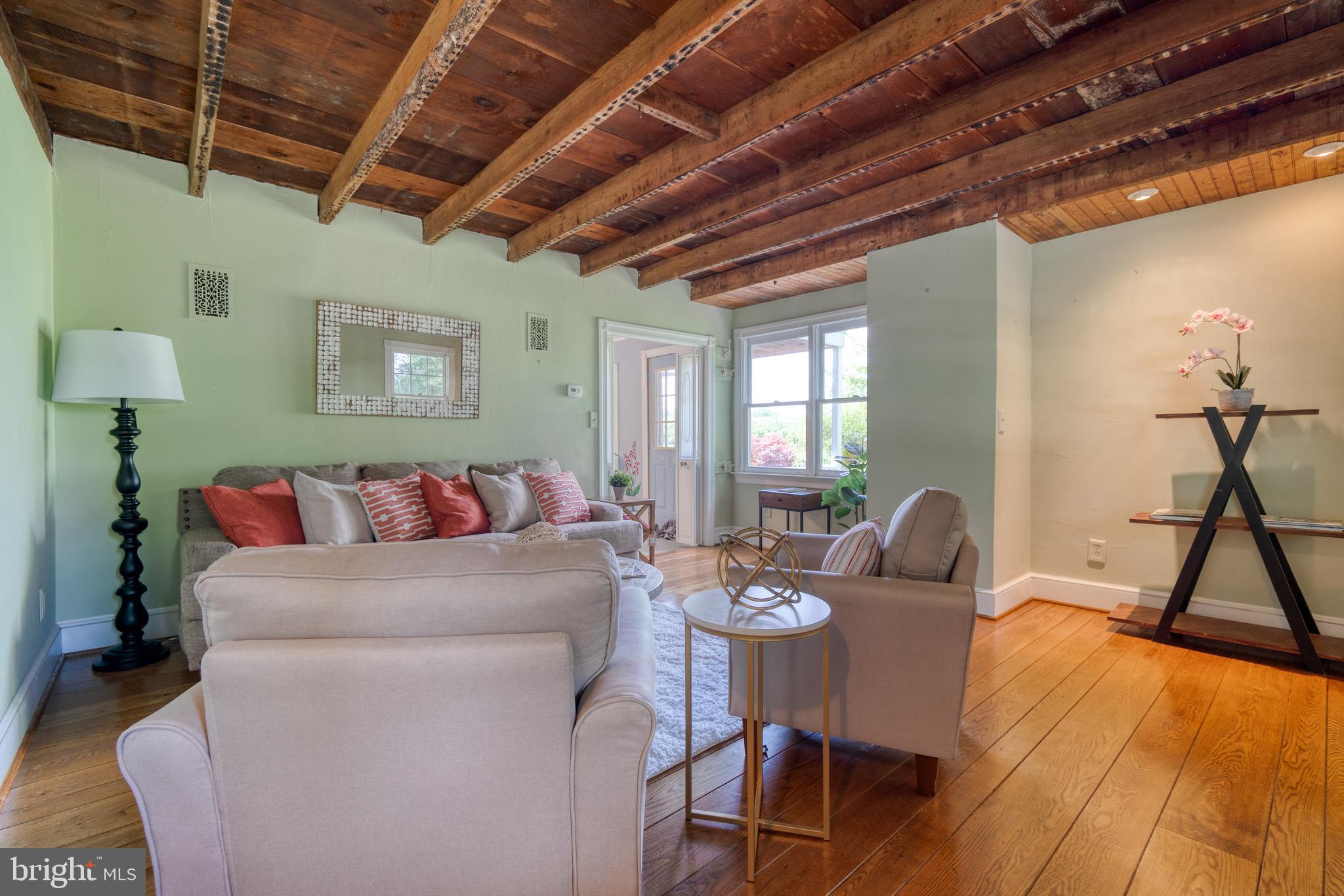 1728 Appleton Road Elkton, MD 21921 - Photo 9 of 36 a living room with furniture a wooden floor and a chandelier