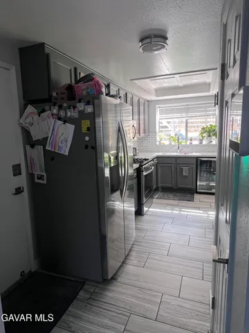 a room with lots of appliances and a window