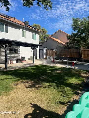 a swimming pool view with a outdoor seating