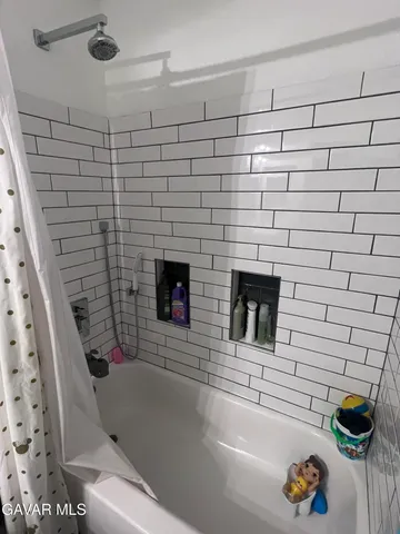 a bathroom with a sink and a shower