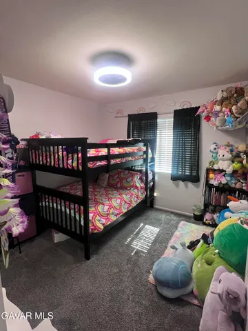 a bed room with a bed and a couch