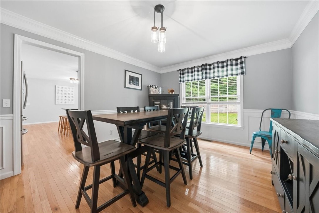 26 Davis Circle Warwick, RI 02886 - Photo 12 of 50 The generously sized formal dining room blends classic elegance with modern functionality