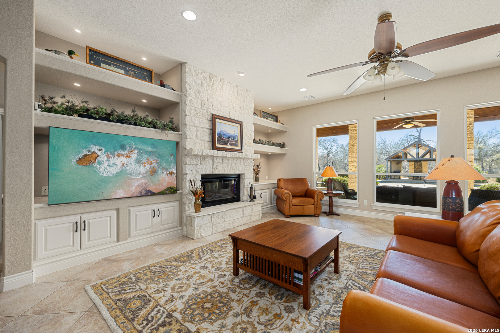 133 Vintage Ranch Circle La Vernia, TX 78121 - Photo 11 of 48 a living room with furniture flat screen tv and a fireplace