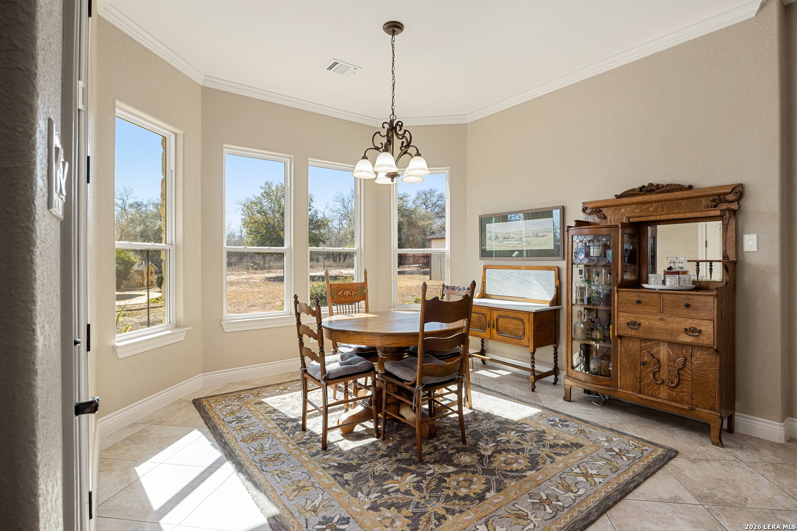 133 Vintage Ranch Circle La Vernia, TX 78121 - Photo 18 of 48 a view of a dining room with furniture window and wooden floor