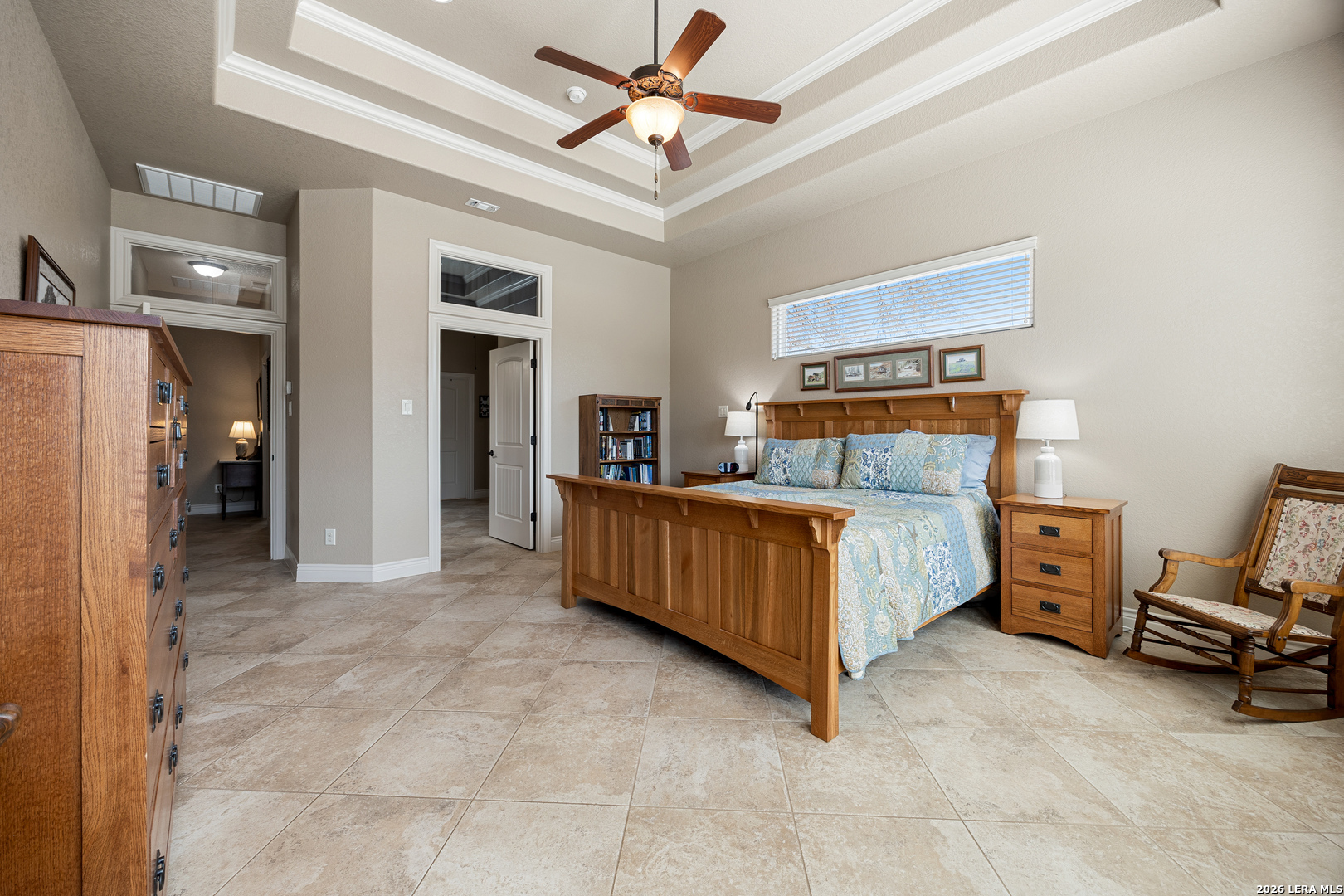 133 Vintage Ranch Circle La Vernia, TX 78121 - Photo 24 of 48 a bed room with a bed and a chandelier