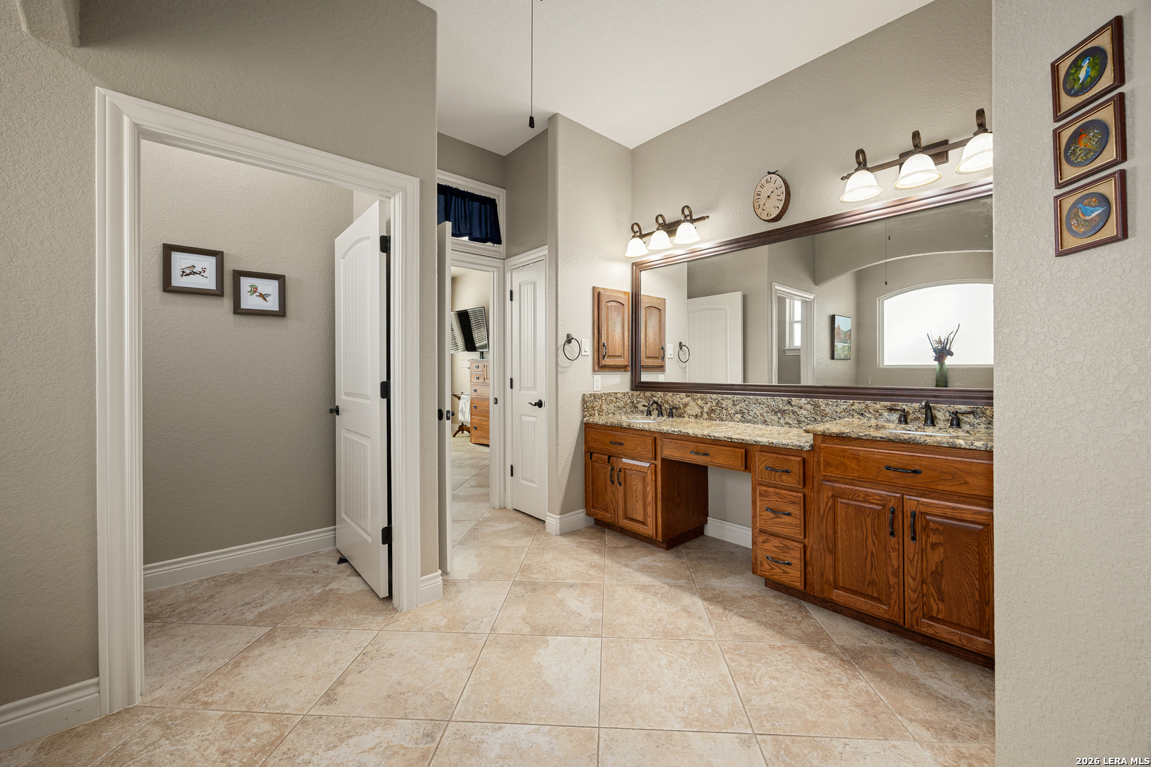 133 Vintage Ranch Circle La Vernia, TX 78121 - Photo 27 of 48 a spacious bathroom with a granite countertop sink mirror and shower