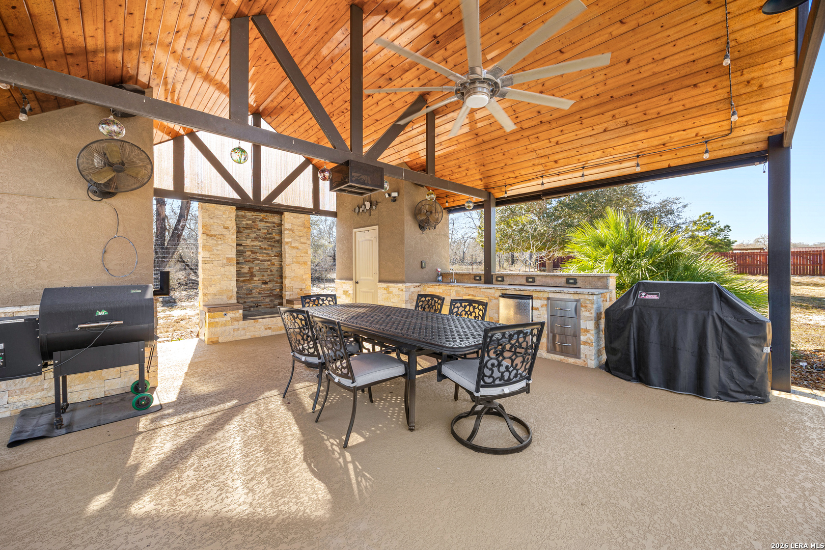 133 Vintage Ranch Circle La Vernia, TX 78121 - Photo 37 of 48 a patio with table and chairs and potted plants