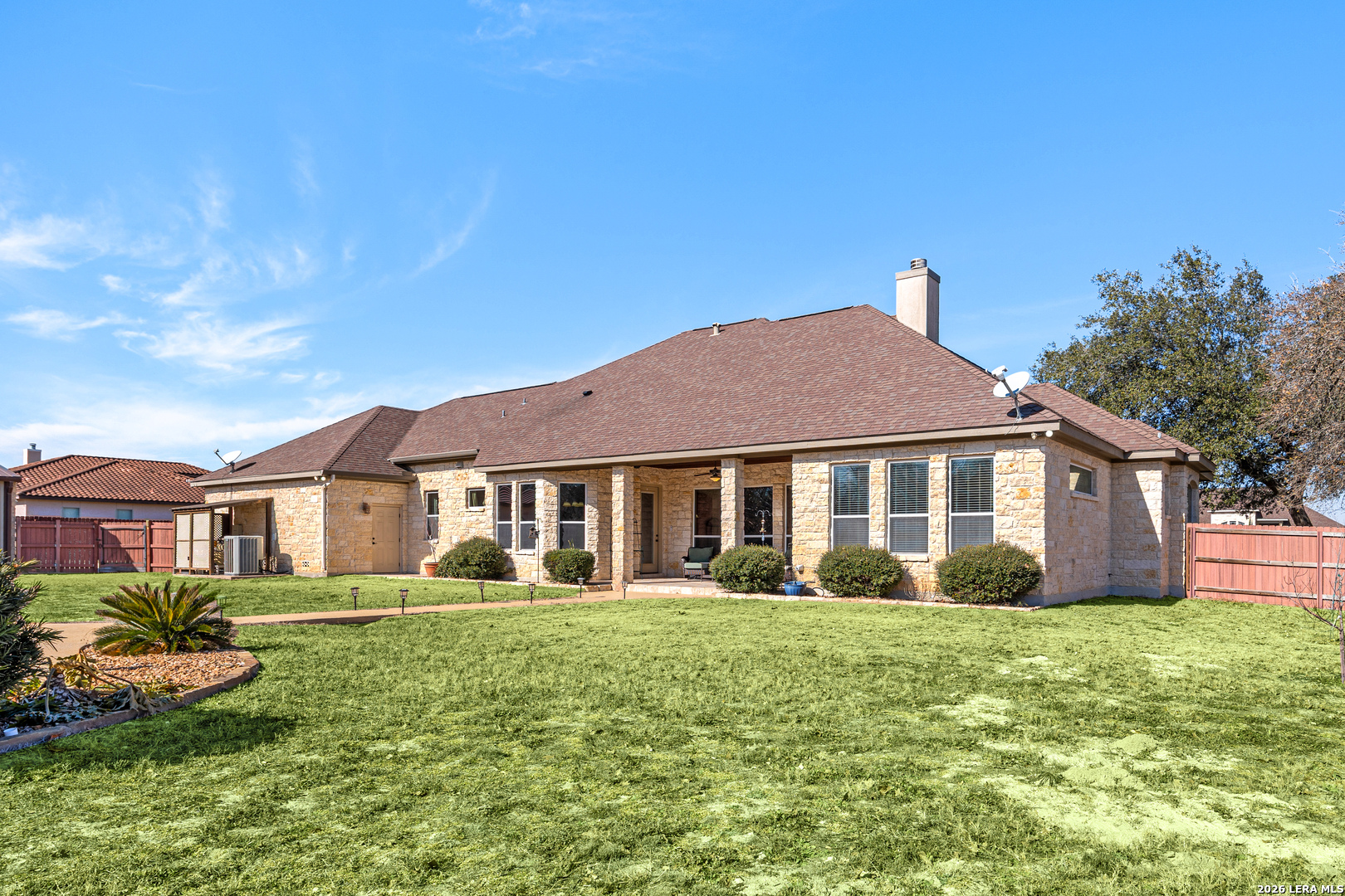 133 Vintage Ranch Circle La Vernia, TX 78121 - Photo 40 of 48 a front view of a house with garden