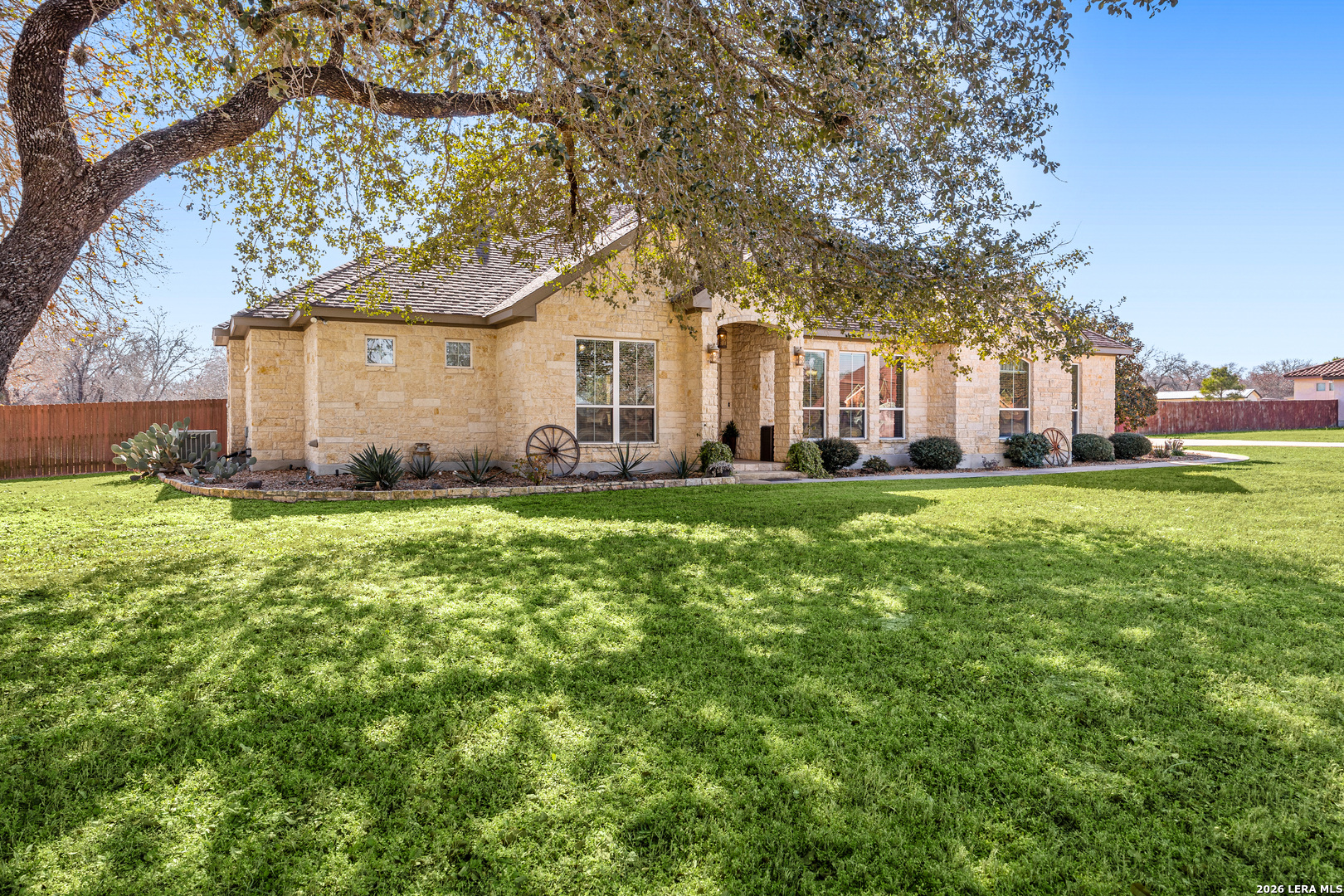 133 Vintage Ranch Circle La Vernia, TX 78121 - Photo 4 of 48 a front view of a house with a yard and trees