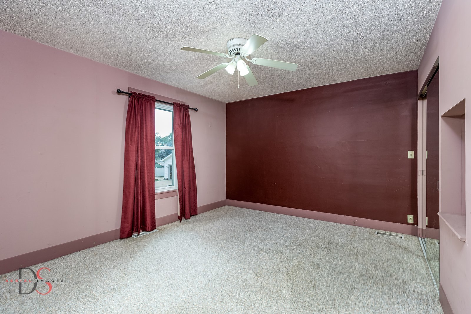 414 West Bluff Street Marseilles, IL 61341 - Photo 11 of 27 an empty room with windows and fan