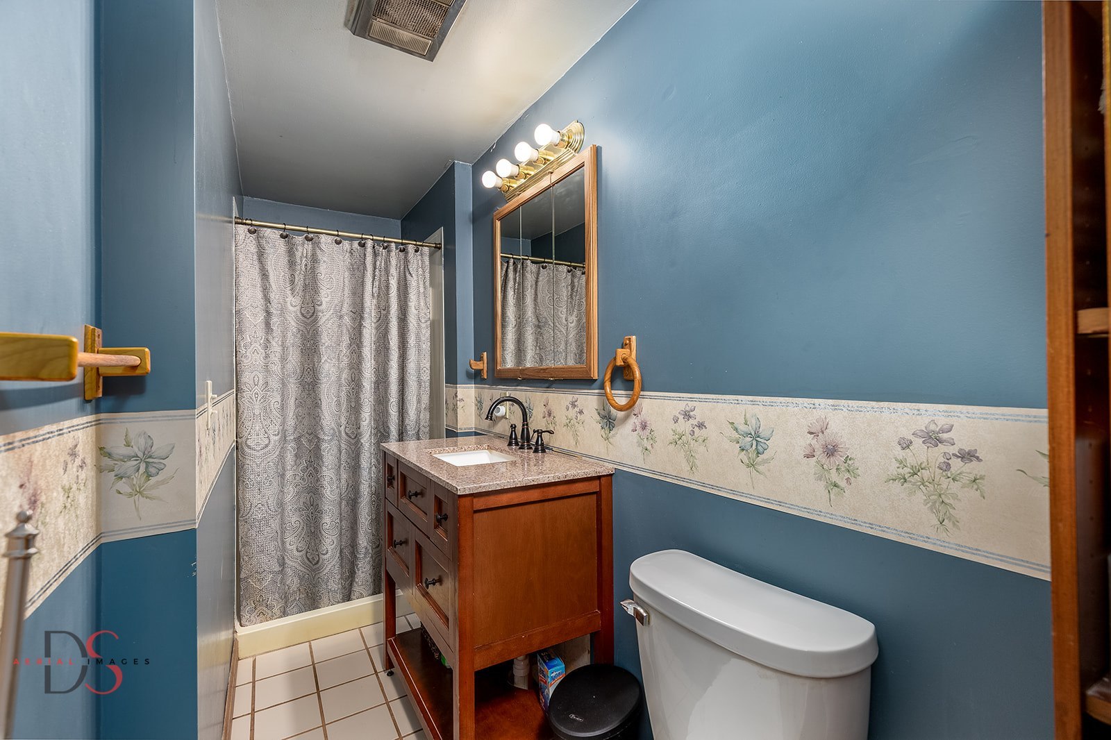 414 West Bluff Street Marseilles, IL 61341 - Photo 12 of 27 a bathroom with a sink toilet vanity and window