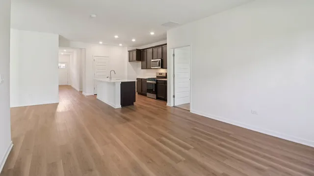 a view of room with wooden floor and window