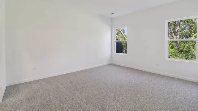 a view of empty room with windows