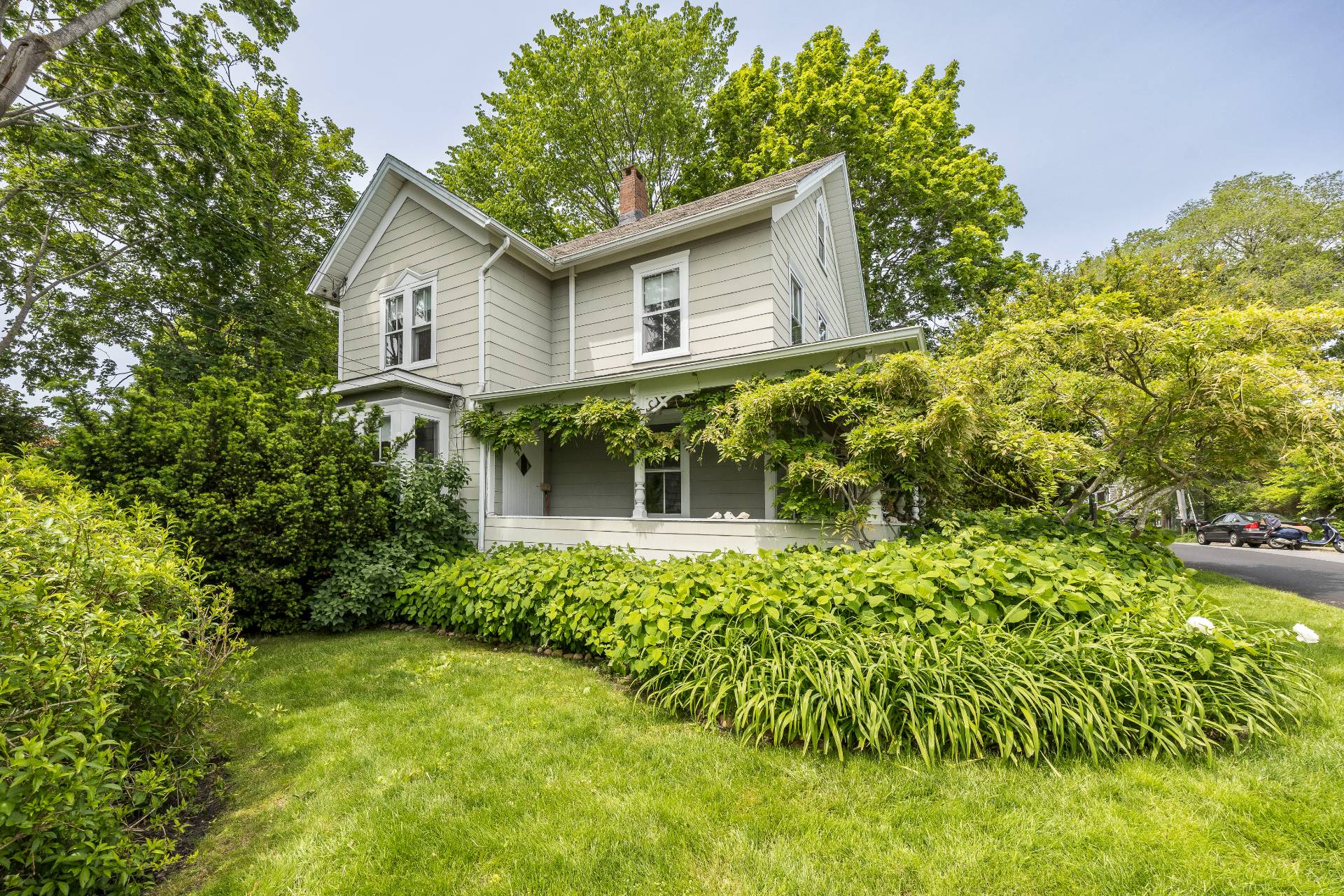 Undisclosed Address Sag Harbor, NY 11963 - Photo 12 of 14 a front view of a house with a yard